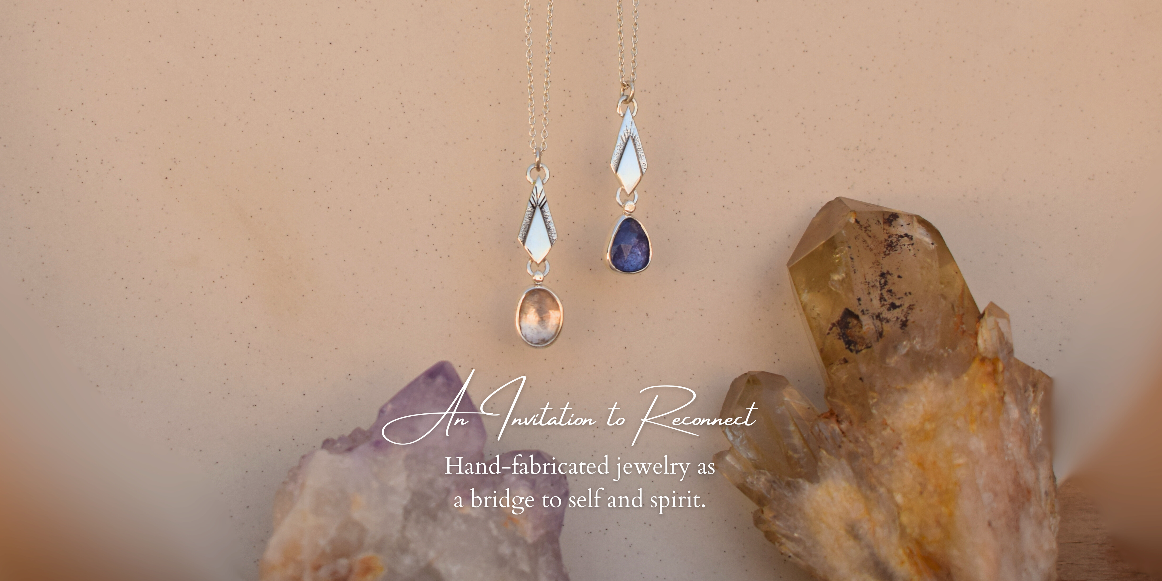 Crystal earrings on a stone surface with text 'An Invitation to Reconnect'.